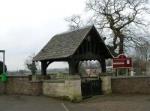 Image: Picture of the church yard with the school in the background